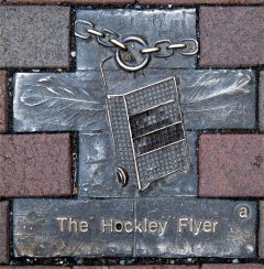Hockley Flyer Wall Plaque Featuring Marie Hoddleton's Shopping Trolley