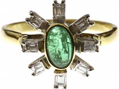 Oval Emerald and Two Row Diamond Cluster