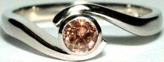 Pink Diamond Solitaire in Rim Set Platinum Crossover