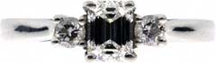 3 Stone Ring with One Emerald Cut and Two Modern Round Brilliant Diamonds