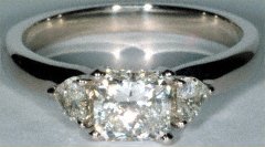 Radiant Cut Diamond Solitaire with Heart Shaped Diamond Side Stones