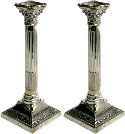 A Pair Of Corinthian Style Candlesticks
